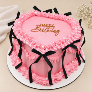 Rosa Vintage-Herztorte mit schwarzen Schleifen, Perlen und Happy-Birthday-Topper